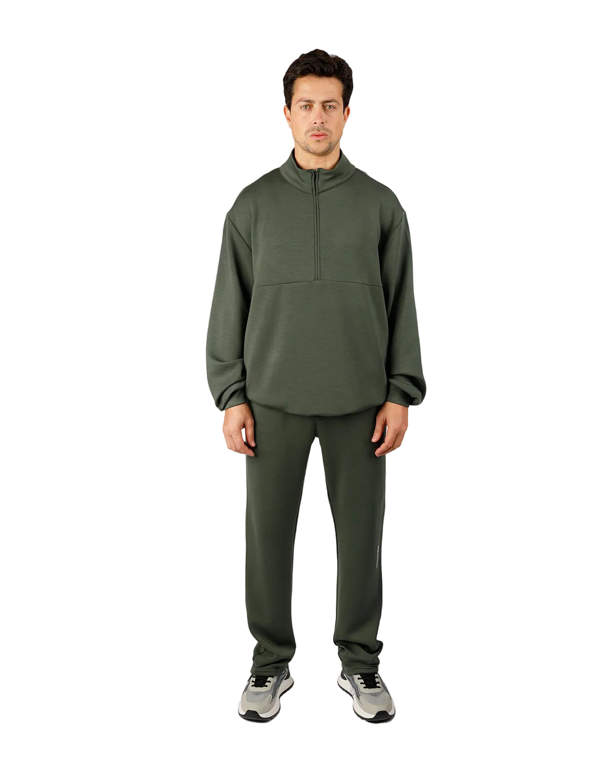 Man wearing a green tracksuit on a white background